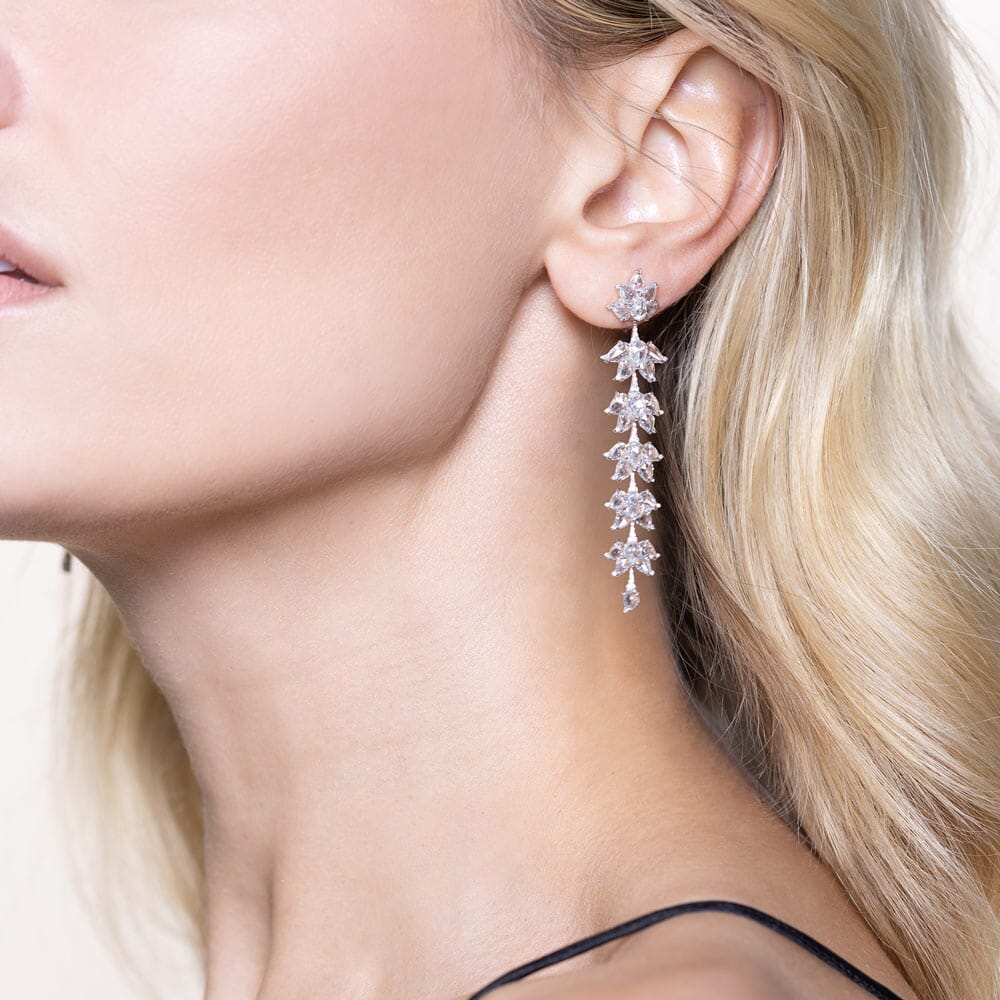 Image of 64Facets Diamond Dangle Earrings with 6 diamond lotus flowers flowing down your ear. Set in 18k gold.